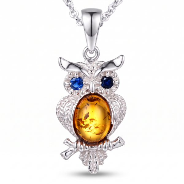 Owl Baltic Amber Pendant in Sterling Silver featuring genuine Baltic amber set in an owl-inspired polished 925 sterling silver design, isolated on a white background.