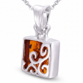 g the Florence Baltic Honey Amber Pendant in Sterling Silver, showcasing genuine honey Baltic amber and polished 925 sterling silver in an elegant luxury jewelry lifestyle setting.