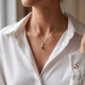 Woman wearing the Sarah Baltic Honey Amber Pendant in Sterling Silver, showcasing genuine honey Baltic amber and polished 925 sterling silver in an elegant luxury jewelry lifestyle setting.