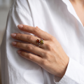 Woman wearing the Tulips Multicolor Baltic Amber Ring in Sterling Silver, showcasing genuine multicolor Baltic amber and polished 925 sterling silver in an elegant luxury jewelry lifestyle setting.
