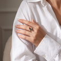 Woman wearing the Baltic Honey Amber Ring in Sterling Silver, showcasing genuine honey Baltic amber and polished 925 sterling silver in an elegant luxury jewelry lifestyle setting.