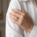 Woman wearing the Baltic Honey Amber Rectangle Ring in Sterling Silver, showcasing genuine honey Baltic amber and polished 925 sterling silver in an elegant luxury jewelry lifestyle setting.