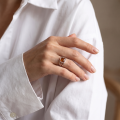 Woman wearing the Baltic Honey Amber Square Ring in Sterling Silver, showcasing genuine honey Baltic amber and polished 925 sterling silver in an elegant luxury jewelry lifestyle setting.