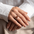 Woman wearing the Lottie Baltic Honey Amber Square Ring in Sterling Silver, showcasing genuine honey Baltic amber and polished 925 sterling silver in an elegant luxury jewelry lifestyle setting.Woman wearing the Lottie Baltic Honey Amber Square Ring in Sterling Silver, showcasing genuine honey Baltic amber and polished 925 sterling silver in an elegant luxury jewelry lifestyle setting.