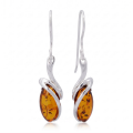 Gemma Baltic Honey Amber Oval Drop Earrings in Sterling Silver featuring genuine oval-shaped honey Baltic amber gemstones set in polished 925 sterling silver, isolated on a white background.