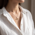 Woman wearing the Bumble Bee Baltic Amber Bumblebee Pendant in Sterling Silver, showcasing genuine Baltic amber and polished 925 sterling silver in an elegant luxury jewelry lifestyle setting.
