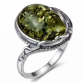Ada Baltic Green Amber Ring in Sterling Silver featuring genuine green Baltic amber set in polished 925 sterling silver, isolated on a white background.