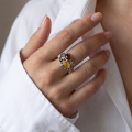 Woman wearing the Coral Reef Multicolor Baltic Amber Ring in Sterling Silver, showcasing genuine multicolor Baltic amber and polished 925 sterling silver in an elegant luxury jewelry lifestyle setting.