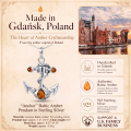 Woman wearing the Anchor Baltic Amber Pendant in Sterling Silver, showcasing genuine Baltic amber and polished 925 sterling silver in an elegant luxury jewelry lifestyle setting.