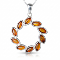 Carrie Baltic Honey Amber Pendant in Sterling Silver featuring genuine honey Baltic amber set in polished 925 sterling silver, isolated on a white background.