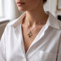 Woman wearing the Baltic Honey Amber Pendant Necklace in Sterling Silver, showcasing genuine honey Baltic amber and polished 925 sterling silver in an elegant luxury jewelry lifestyle setting.