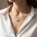 Woman wearing the Hearts Baltic Honey Amber Pendant in Sterling Silver, showcasing genuine honey Baltic amber and polished 925 sterling silver in an elegant luxury jewelry lifestyle setting.
