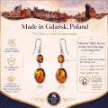 Michelle Baltic Honey Amber Drop Earrings in Sterling Silver infographic highlighting authentic honey Baltic amber, 925 sterling silver, handcrafted craftsmanship, earring dimensions, and Made in Gdańsk, Poland heritage.
