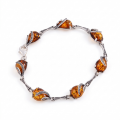 Aniela Baltic Honey Amber Bracelet in Sterling Silver featuring genuine honey Baltic amber gemstones set in polished 925 sterling silver, isolated on a white background.