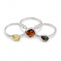 Multicolor Baltic Amber Ring in Sterling Silver featuring genuine multicolor Baltic amber gemstones set in polished 925 sterling silver, isolated on a white background.