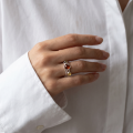 Woman wearing the Multicolor Baltic Amber Ring in Sterling Silver, showcasing genuine multicolor Baltic amber and polished 925 sterling silver in an elegant luxury jewelry lifestyle setting.