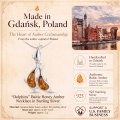 Dolphins Baltic Honey Amber Necklace in Sterling Silver infographic highlighting authentic honey Baltic amber, 925 sterling silver, dolphin-inspired design, handcrafted craftsmanship, necklace dimensions, and Made in Gdańsk, Poland heritage.