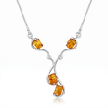 Ines Baltic Honey Amber Necklace in Sterling Silver featuring genuine honey Baltic amber set in polished 925 sterling silver, isolated on a white background.