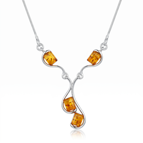 Ines Baltic Honey Amber Necklace in Sterling Silver featuring genuine honey Baltic amber set in polished 925 sterling silver, isolated on a white background.