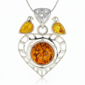 Baltic Honey Amber Heart Pendant in Sterling Silver featuring genuine honey Baltic amber set in a heart-shaped polished 925 sterling silver design, isolated on a white background.