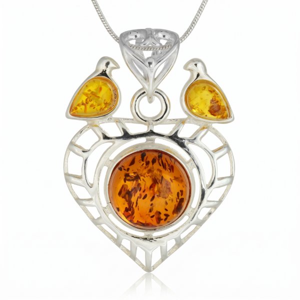 Baltic Honey Amber Heart Pendant in Sterling Silver featuring genuine honey Baltic amber set in a heart-shaped polished 925 sterling silver design, isolated on a white background.