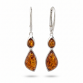 Baltic Honey Amber Drop Earrings in Sterling Silver featuring genuine honey Baltic amber gemstones set in polished 925 sterling silver, isolated on a white background.Baltic Honey Amber Drop Earrings in Sterling Silver featuring genuine honey Baltic amber gemstones set in polished 925 sterling silver, isolated on a white background.