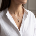 Woman wearing the Martina Multicolor Baltic Amber Pendant in Sterling Silver, showcasing genuine multicolor Baltic amber and polished 925 sterling silver in an elegant luxury jewelry lifestyle setting.