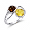 Baltic Honey Amber Ring in Sterling Silver featuring genuine honey Baltic amber set in polished 925 sterling silver, isolated on a white background.Baltic Honey Amber Ring in Sterling Silver featuring genuine honey Baltic amber set in polished 925 sterling silver, isolated on a white background.