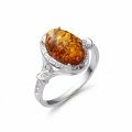 Baltic Honey Amber Ring in Sterling Silver featuring genuine honey Baltic amber set in polished 925 sterling silver, isolated on a white background.