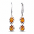 Infinity Baltic Honey Amber Earrings in Sterling Silver featuring genuine honey Baltic amber gemstones set in polished 925 sterling silver, isolated on a white background.