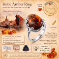 Dana Cherry Baltic Amber Ring in Sterling Silver infographic highlighting authentic cherry Baltic amber, 925 sterling silver, handcrafted craftsmanship, ring dimensions, and Made in Gdańsk, Poland heritage.