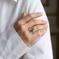 Woman wearing the Baltic Amber Leaf Ring in Sterling Silver, showcasing genuine Baltic amber and polished 925 sterling silver in an elegant luxury jewelry lifestyle setting.