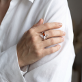 Woman wearing the Baltic Honey Amber Bumblebee Ring in Sterling Silver, showcasing genuine honey Baltic amber and polished 925 sterling silver in an elegant luxury jewelry lifestyle setting.