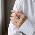 Woman wearing the Baltic Honey Amber Dragonfly Adjustable Ring in Sterling Silver, showcasing genuine honey Baltic amber and polished 925 sterling silver in an elegant luxury jewelry lifestyle setting.