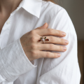 Woman wearing the Baltic Honey Amber Dragonfly Adjustable Ring in Sterling Silver, showcasing genuine honey Baltic amber and polished 925 sterling silver in an elegant luxury jewelry lifestyle setting.
