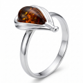 Baltic Honey Amber Pear-Shaped Ring in Sterling Silver featuring genuine pear-shaped honey Baltic amber set in polished 925 sterling silver, isolated on a white background.