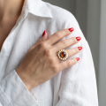 Woman wearing the Baltic Honey Amber Sunflower Ring in Gold-Plated Sterling Silver, showcasing genuine honey Baltic amber and polished gold-plated 925 sterling silver in an elegant luxury jewelry lifestyle setting.