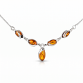 Gemma Baltic Honey Amber Necklace in Sterling Silver featuring genuine honey Baltic amber set in polished 925 sterling silver, isolated on a white background.