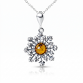 Snowflake Baltic Amber Pendant in Sterling Silver featuring genuine Baltic amber set in a polished 925 sterling silver snowflake design, isolated on a white background.