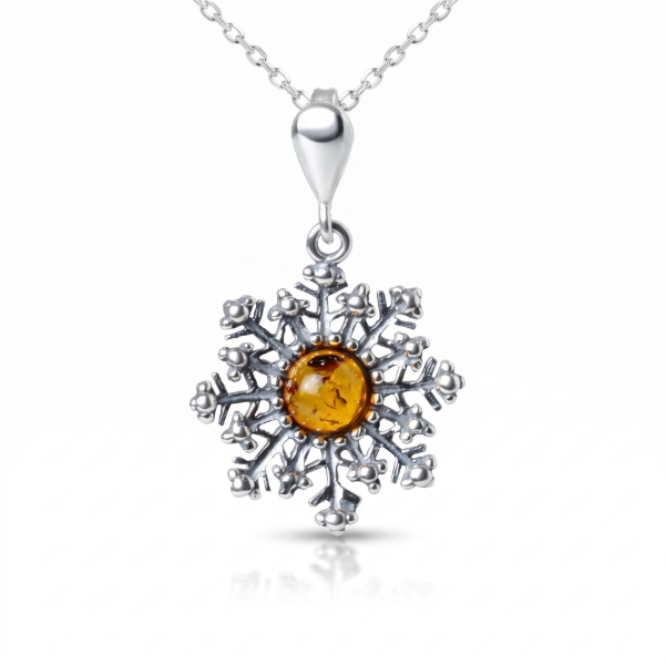 Snowflake Baltic Amber Pendant in Sterling Silver featuring genuine Baltic amber set in a polished 925 sterling silver snowflake design, isolated on a white background.