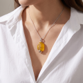 Baltic Butterscotch Amber Pendant in Sterling Silver infographic highlighting authentic butterscotch Baltic amber, 925 sterling silver, handcrafted craftsmanship, pendant dimensions, and Made in Gdańsk, Poland heritage.