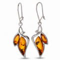 Charlotte Baltic Honey Amber Earrings in Sterling Silver featuring genuine honey Baltic amber gemstones set in polished 925 sterling silver, isolated on a white background.
