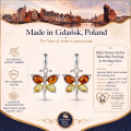 Baltic Honey Amber Butterflies Earrings in Sterling Silver infographic highlighting authentic honey Baltic amber, 925 sterling silver, butterfly design, handcrafted craftsmanship, earring dimensions, and Made in Gdańsk, Poland heritage.