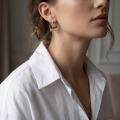 Woman wearing the Baltic Honey Amber Butterflies Earrings in Sterling Silver, showcasing genuine honey Baltic amber gemstones and polished 925 sterling silver in an elegant luxury jewelry lifestyle setting.