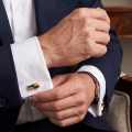 Man wearing the Baltic Honey Amber Cufflinks in Sterling Silver, showcasing genuine honey Baltic amber gemstones and polished 925 sterling silver in an elegant luxury jewelry lifestyle setting.