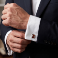 Man wearing the Baltic Honey Amber Cufflinks in Sterling Silver, showcasing genuine honey Baltic amber gemstones and polished 925 sterling silver in an elegant luxury jewelry lifestyle setting.