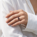 Woman wearing the Bohemian Garnet Ring in Rhodium-Plated Sterling Silver, showcasing genuine Bohemian garnet gemstones and polished rhodium-plated 925 sterling silver in an elegant luxury jewelry lifestyle setting.