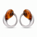 Pair of “Nelia” Baltic Honey Amber earrings in polished sterling silver, displayed on a white background.