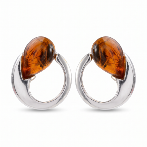 Pair of “Nelia” Baltic Honey Amber earrings in polished sterling silver, displayed on a white background.