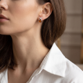 Close-up of a model wearing a Baltic Honey Amber Stud Earring in Sterling Silver.